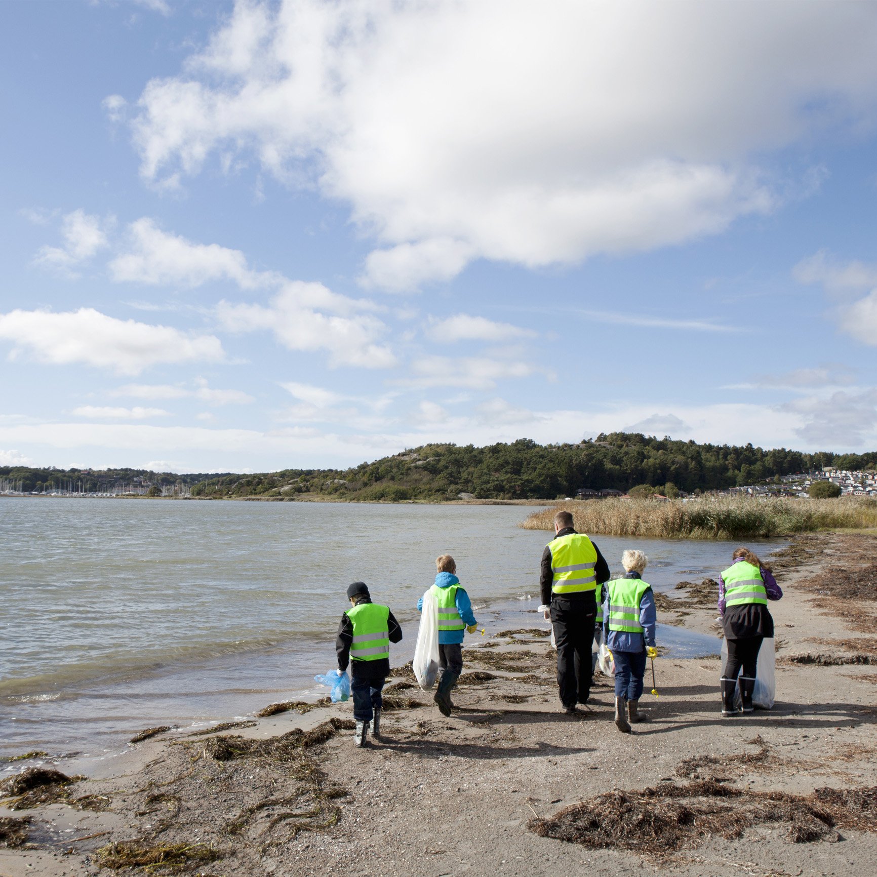 Beach clean up with young kids and adult