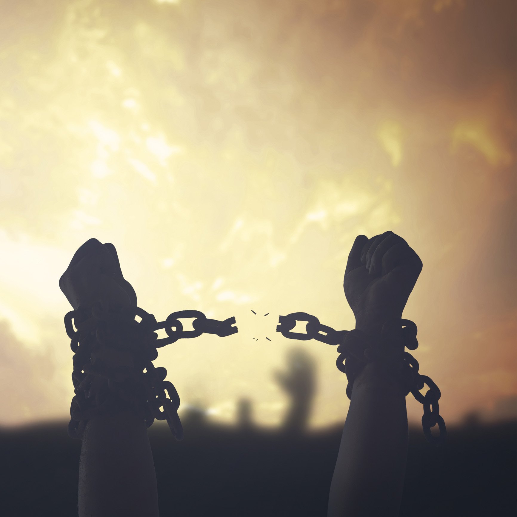 Hands break free of chains