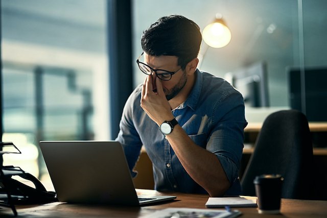 Man suffering from working stress