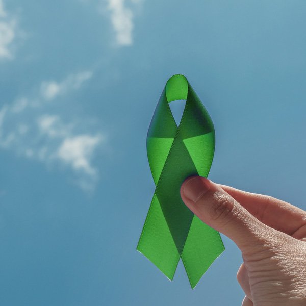 Green ribbon against blue sky