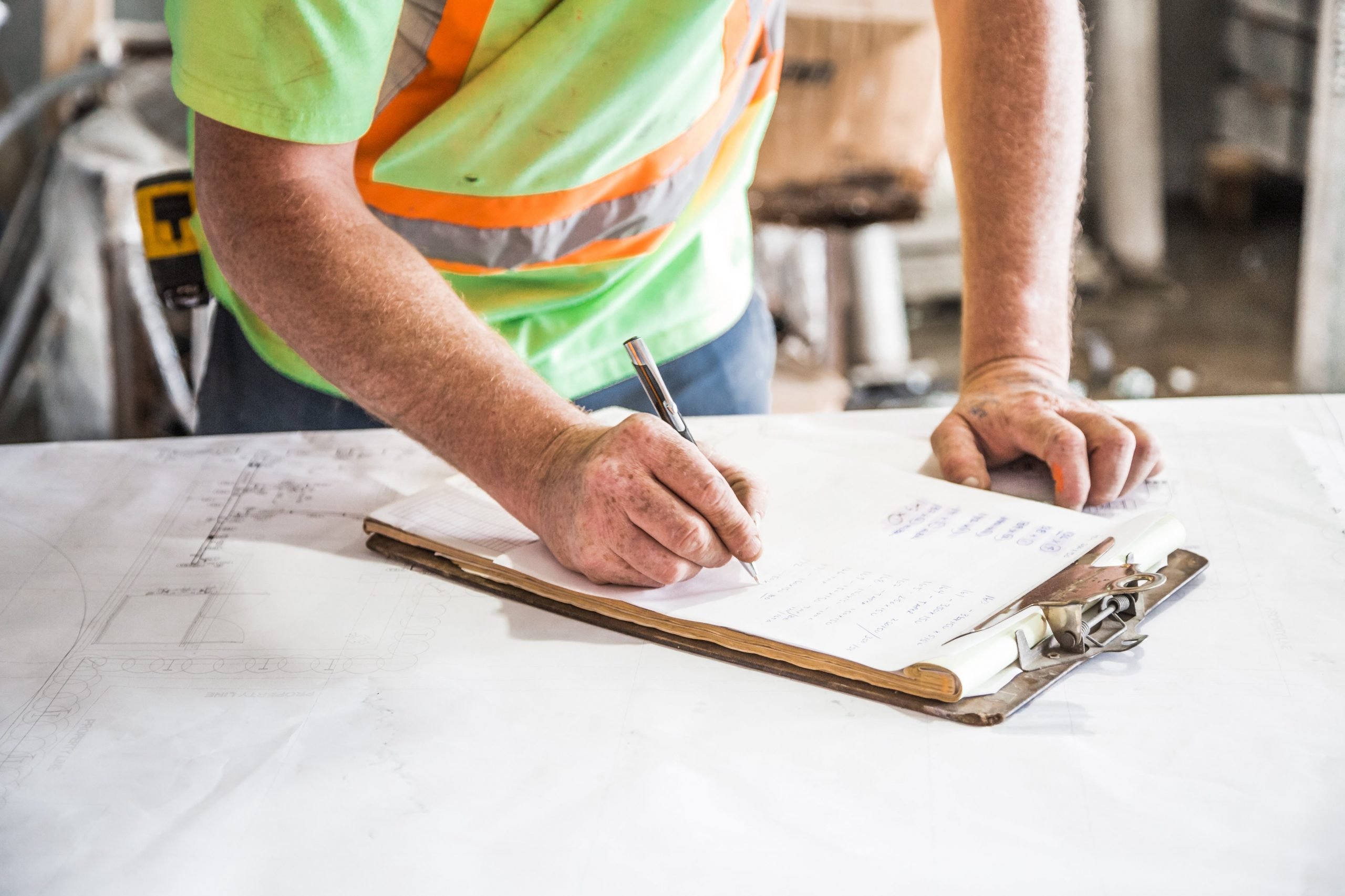 Construction worker filling out risk assessment form