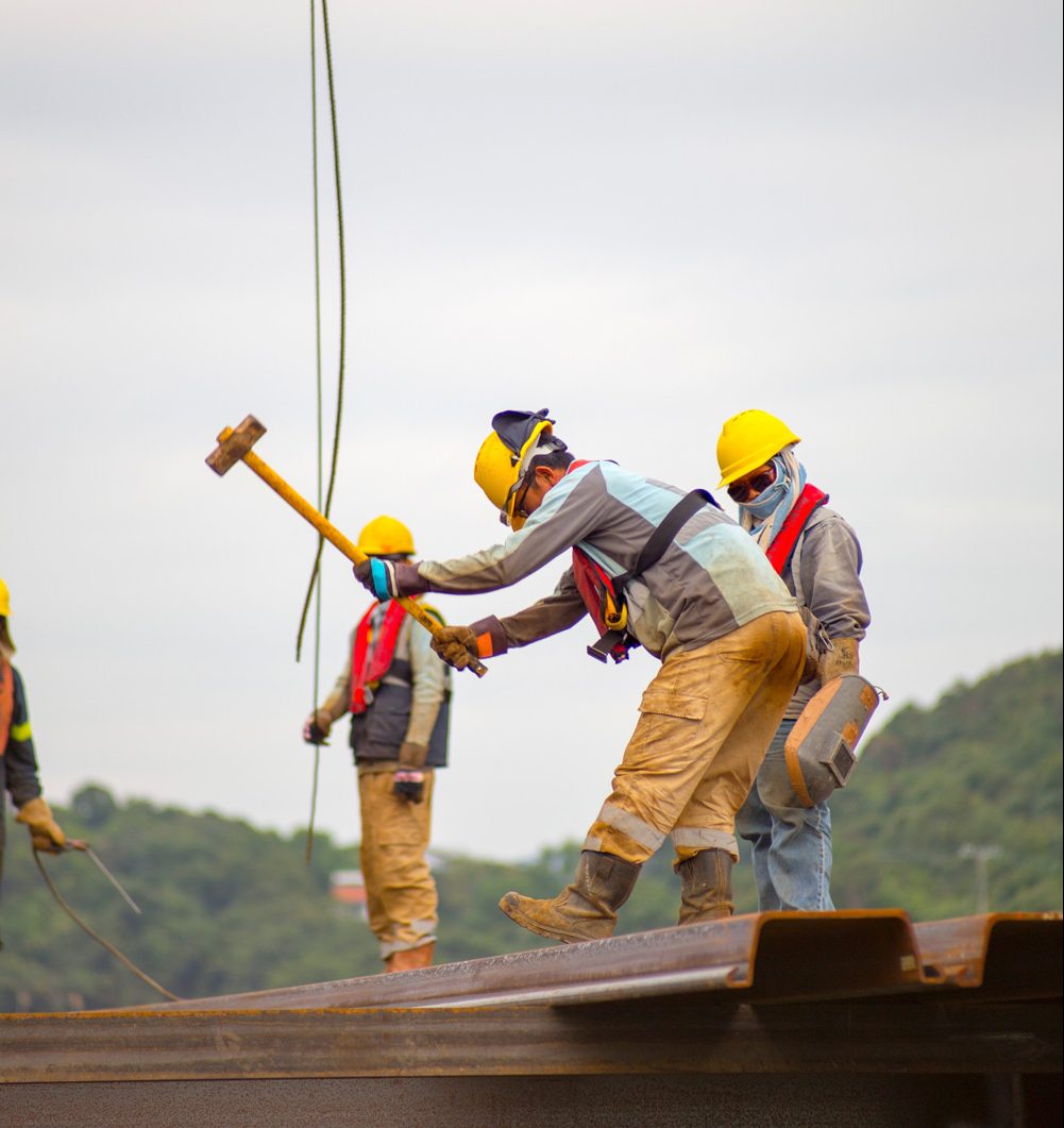 Workmen with hardhats on scaffolding