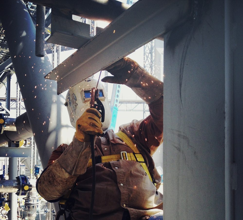 Metal welder with flying sparks