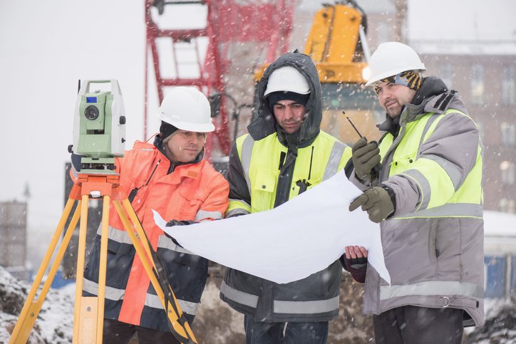 Civil Engineers At Construction Site In Winter