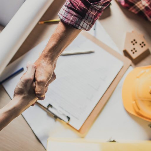 Client and contractor shaking hands following tender agreement / SMAS Worksafe