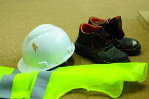 Construction PPE including hard hat, hi vis and boots